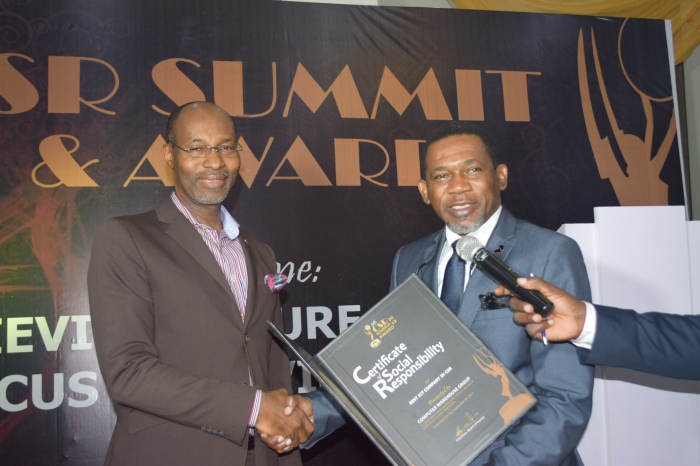 1.Dr. Adeshina Fagbenro-Bryon, Director, United Kingdom Department for International Development (DFID) presenting the Best ICT Company in CSR to Mr. Phillip Obioha, the Chief Operating Officer, CWG Plc, at the 2015 Annual CSR Summit and awards ceremony held in Lagos